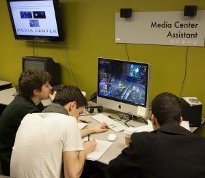 students learning from a video game